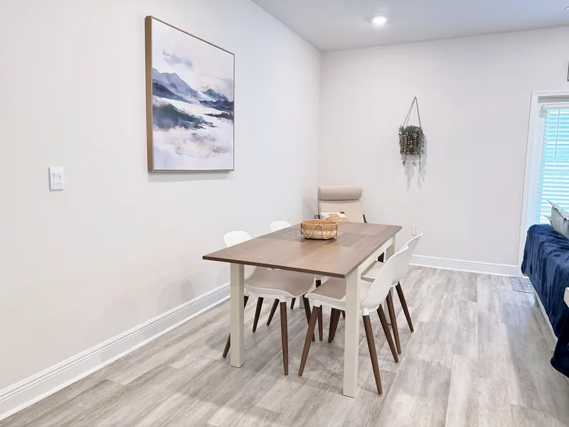 Bright living room with comfortable seating and natural light in the Warrington townhome rental