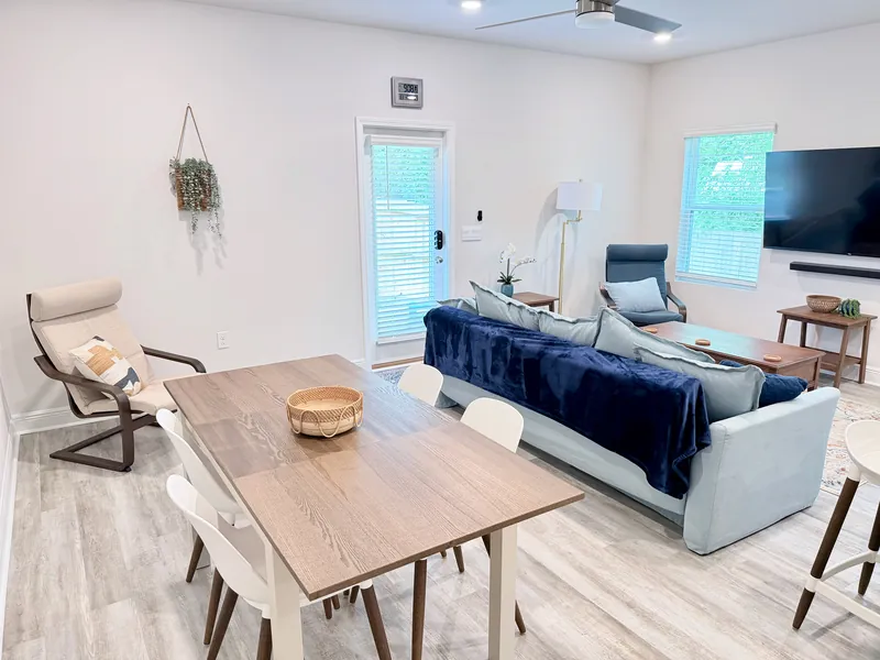 Living area with 65-inch smart TV and soundbar, streaming ready for long stays