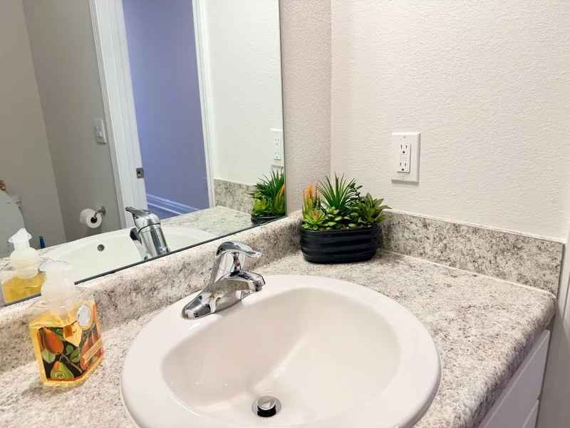 Half bathroom on the main floor of the three-bedroom townhome