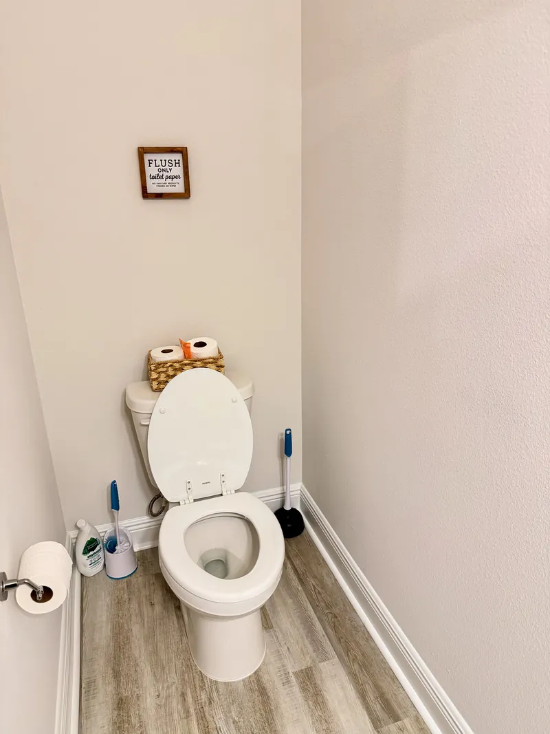 Powder room vanity with mirror on the first floor