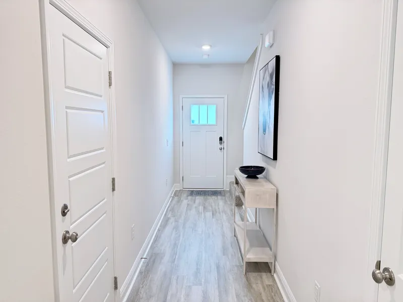 Staircase leading to the second floor bedrooms of the end-unit townhome