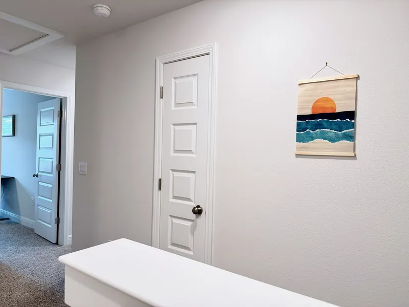 Second floor landing with linen storage in the Ellie's Cove townhome