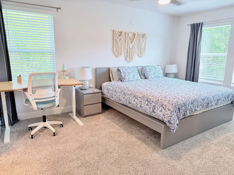 Primary bedroom with king bed, smart TV and ensuite bathroom