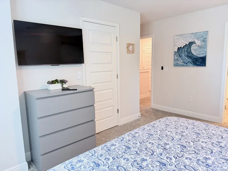 Primary suite with wall-mounted TV, ideal for military TDY long stays