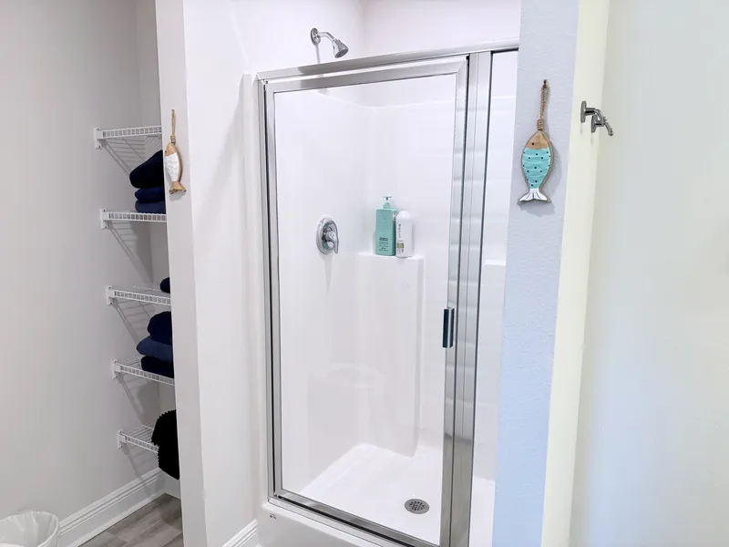 Primary bathroom shower with glass enclosure