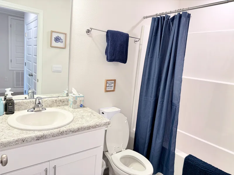 Second full bathroom with tub and shower combination