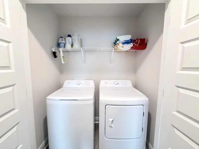 In-unit full size washer and dryer laundry area