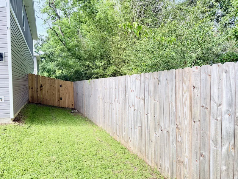 Large fenced backyard, pet friendly outdoor space at the Ellie's Cove townhome